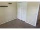 Bedroom featuring built-in shelving and a double door closet at 314 Casterton Cir, Davenport, FL 33897