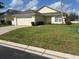 Charming single-story home with well-maintained lawn, and two car garage at 314 Casterton Cir, Davenport, FL 33897