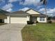 Charming single-story home with well-maintained lawn, and two car garage at 314 Casterton Cir, Davenport, FL 33897