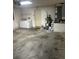 Spacious garage with laundry machines, water heater, and plenty of open floor space at 314 Casterton Cir, Davenport, FL 33897