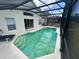 Screened-in swimming pool with lounge seating and clear water for relaxing at 314 Casterton Cir, Davenport, FL 33897
