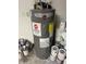 Gray Rheem Performance water heater surrounded by paint cans at 314 Casterton Cir, Davenport, FL 33897