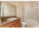 This bathroom features a vanity, toilet, and shower and tub combo with tile surround at 3205 Sonesta Ct # F, Clermont, FL 34711
