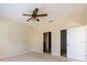 Bedroom with ceiling fan, closet and bath doors; ample space and modern conveniences make this a comfortable retreat at 3205 Sonesta Ct # F, Clermont, FL 34711