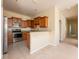 Modern kitchen featuring stainless steel appliances and granite countertops at 3205 Sonesta Ct # F, Clermont, FL 34711