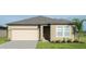 Charming single-story home with a well-maintained lawn, two-car garage, and welcoming entrance at 3343 Twilight Rd, Winter Haven, FL 33881