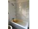 Bathtub with shelves and showerhead in bathroom at 3772 Cochran St, Apopka, FL 32703