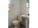 Oblique view of a bathroom featuring a sink and toilet at 3772 Cochran St, Apopka, FL 32703
