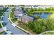 Aerial view of a well-manicured property with pool, pond and landscaping at 427 Egret Place Dr, Winter Garden, FL 34787