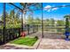 Enclosed patio area with dog area and well-manicured landscaping at 427 Egret Place Dr, Winter Garden, FL 34787