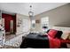 Bright bedroom with wood floors, large windows, and a comfortable bed at 427 Egret Place Dr, Winter Garden, FL 34787