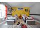 bedroom featuring two twin beds with colorful decor and a playful Mickey Mouse theme at 427 Egret Place Dr, Winter Garden, FL 34787
