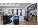 Well-appointed bonus room with arcade games, comfortable seating, and blue accents at 427 Egret Place Dr, Winter Garden, FL 34787