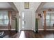 Bright and inviting foyer with hardwood floors, high ceilings, and decorative plants at 427 Egret Place Dr, Winter Garden, FL 34787