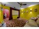 Brightly colored home theater with projector screen, comfortable seating, and themed decor at 427 Egret Place Dr, Winter Garden, FL 34787