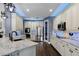Modern kitchen with stainless steel appliances, white cabinets, granite countertops, and wood floors at 427 Egret Place Dr, Winter Garden, FL 34787