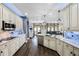 Open kitchen featuring granite countertops, stainless steel appliances and ample cabinet space at 427 Egret Place Dr, Winter Garden, FL 34787