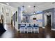 Modern kitchen featuring granite countertops, a center island with barstool seating and pendant lights at 427 Egret Place Dr, Winter Garden, FL 34787