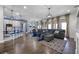 Open concept living room featuring a large sectional sofa with a decorative rug at 427 Egret Place Dr, Winter Garden, FL 34787