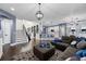 Open-concept living space with a staircase and kitchen, creating a bright and airy atmosphere at 427 Egret Place Dr, Winter Garden, FL 34787
