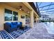 Covered patio featuring comfortable seating area and backyard access at 427 Egret Place Dr, Winter Garden, FL 34787