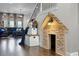 Hallway play nook featuring a playhouse under the stairs with wood floors at 427 Egret Place Dr, Winter Garden, FL 34787