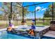 Beautiful pool featuring unique Disney statues and lush backyard views at 427 Egret Place Dr, Winter Garden, FL 34787