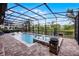 Large backyard pool, with hot tub and lush surroundings at 427 Egret Place Dr, Winter Garden, FL 34787