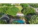 Aerial view of community pool, sand volleyball court, playground, and green space at 453 Kettering Rd, Deltona, FL 32725
