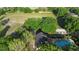 Birds eye view of community playground, sand volleyball court, and green space at 453 Kettering Rd, Deltona, FL 32725