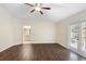 Spacious bedroom with new hardwood floors and ensuite bathroom entrance, offering comfort and privacy at 453 Kettering Rd, Deltona, FL 32725