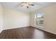 Inviting bedroom with hardwood floors and a large window providing natural light at 453 Kettering Rd, Deltona, FL 32725