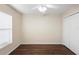 Bedroom features wood-look flooring, closet, and ceiling fan at 453 Kettering Rd, Deltona, FL 32725