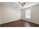Bright bedroom features wood-look flooring, closet and ceiling fan at 453 Kettering Rd, Deltona, FL 32725