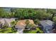 Charming single-story home featuring a two-car garage, well-manicured lawn, and tropical palm trees at 453 Kettering Rd, Deltona, FL 32725