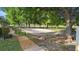 A sand volleyball court with nearby playground in a lushly landscaped community at 453 Kettering Rd, Deltona, FL 32725