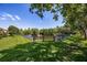Expansive backyard with a picturesque pond, perfect for relaxation and enjoying nature's beauty, with ample green space at 484 Harbor Winds Ct, Winter Springs, FL 32708