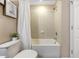 Clean bathroom features a shower-tub combo with beige tile and decor details at 484 Harbor Winds Ct, Winter Springs, FL 32708