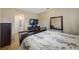 Neutral bedroom boasts wood flooring, decor and archway leading to the ensuite bathroom at 484 Harbor Winds Ct, Winter Springs, FL 32708