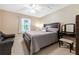 Comfortable bedroom features a ceiling fan and coordinated decor, offering a relaxing retreat at 484 Harbor Winds Ct, Winter Springs, FL 32708