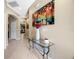 Stylish foyer with tile flooring, artwork, and a console table leading to other rooms at 484 Harbor Winds Ct, Winter Springs, FL 32708