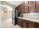 Kitchen with stainless steel appliances and lots of cabinet space, with view to entry and dining area at 484 Harbor Winds Ct, Winter Springs, FL 32708