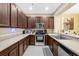Functional kitchen featuring ample cabinet space, modern stainless-steel appliances, and bright countertops at 484 Harbor Winds Ct, Winter Springs, FL 32708