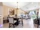 Bright dining area adjacent to a living room with comfortable seating and natural light at 484 Harbor Winds Ct, Winter Springs, FL 32708
