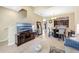 Bright living space flows into the dining area with a view of the kitchen and staircase at 484 Harbor Winds Ct, Winter Springs, FL 32708