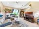 Inviting living room with comfortable sofas, stylish decor, and a sliding glass door offering natural light at 484 Harbor Winds Ct, Winter Springs, FL 32708