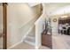 Carpeted staircase in a home leading to upper levels, adjacent to the dining area and living room at 484 Harbor Winds Ct, Winter Springs, FL 32708