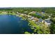 Expansive aerial view showcasing a lakeside community with beautiful homes and private docks at 5112 Jetsail Dr, Orlando, FL 32812