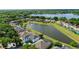 Beautiful aerial view of a home with a lake and lush green surroundings at 5112 Jetsail Dr, Orlando, FL 32812