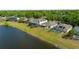 Aerial backyard view with lakefront access and green lawn at 5112 Jetsail Dr, Orlando, FL 32812